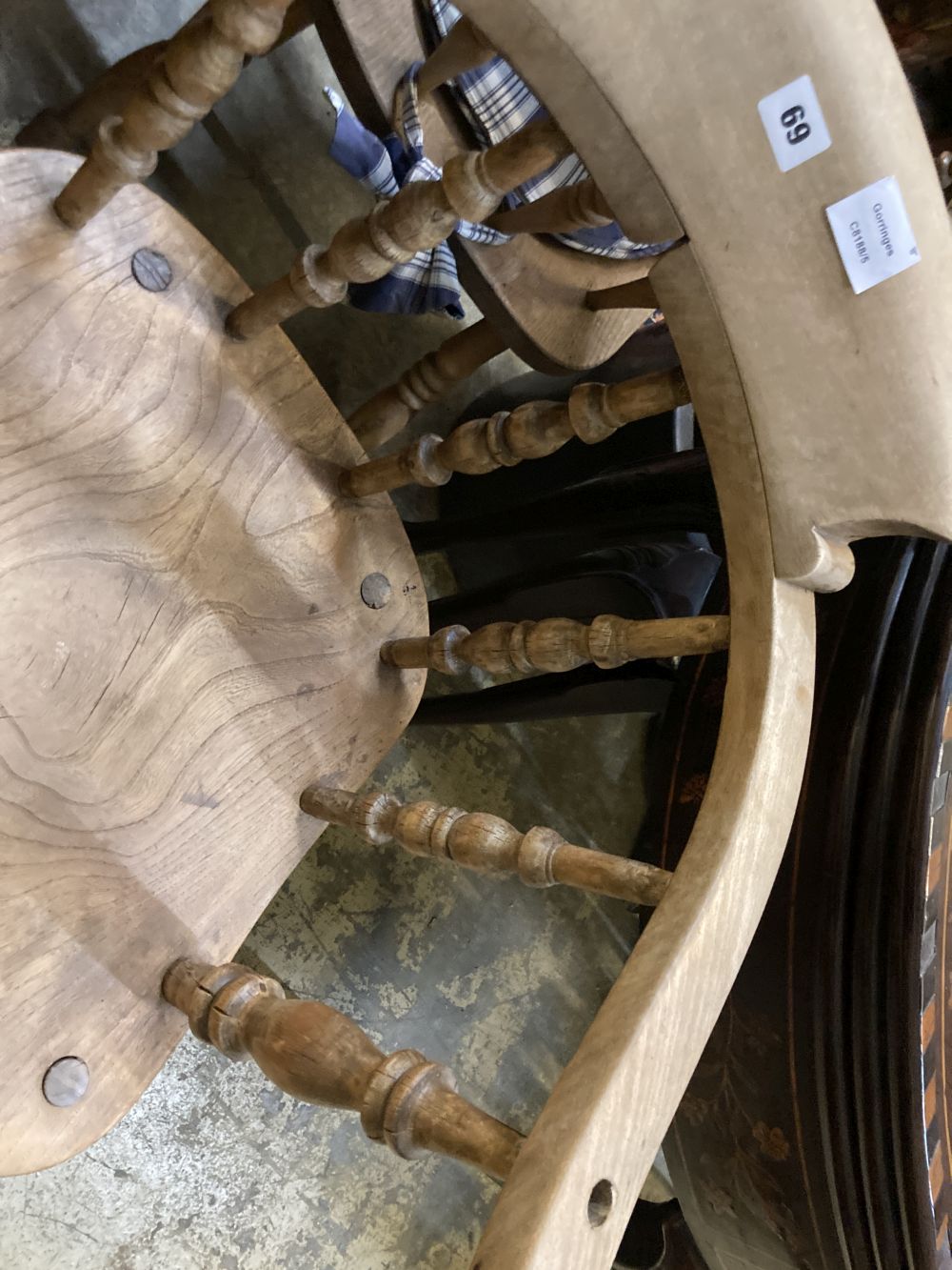 Two Victorian elm and beech smokers bow elbow chairs together with six Windsor kitchen chairs